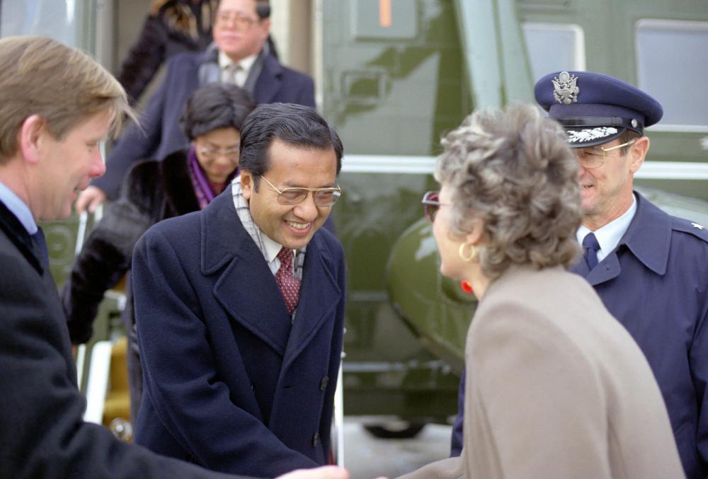 Dr. Mahathir bin Mohamad, prime minister of Malaysia, is greeted upon his arrival for a state visit to the United States in 1984