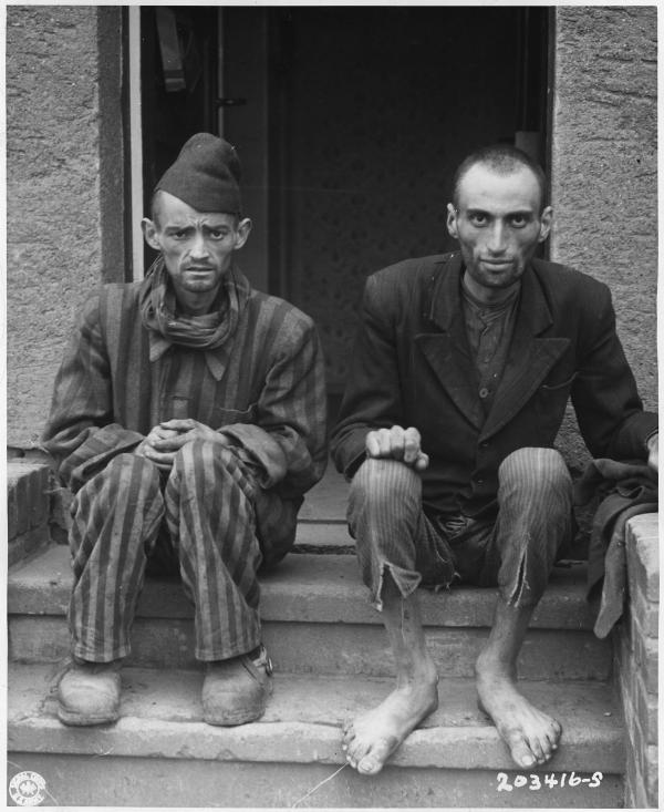 Two men sitting after liberation from Lager-Nordhausen Death Camp